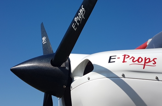 E-Props carbon spinner mounted on an aircraft propeller in flight